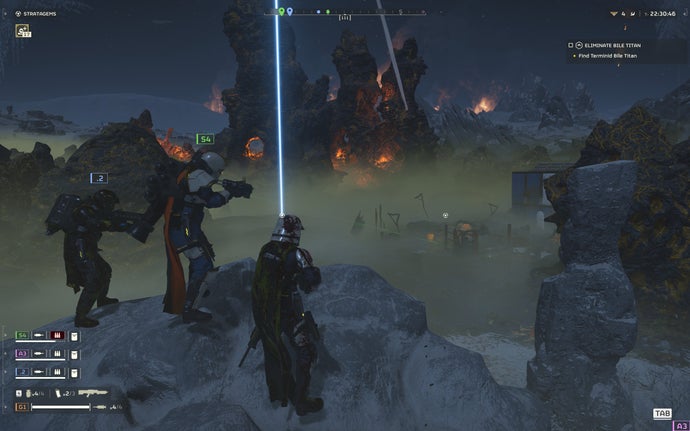 Helldivers 2 screenshot showing Three helldivers look down on an abandoned facility filled with bugs, on a murky green planet with fires raging in the background.