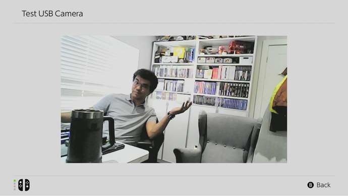 The author sits in his office in a closer, grainier shot taken using the Piranha Plant camera.