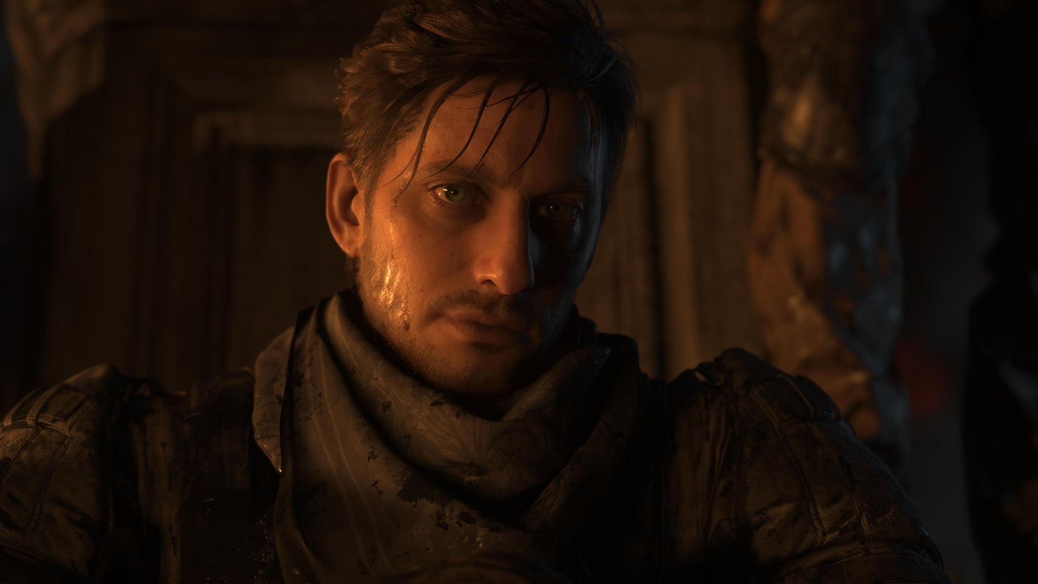 Death Stranding 2 screenshot showing close up of Neil, looking sweaty in military outfit