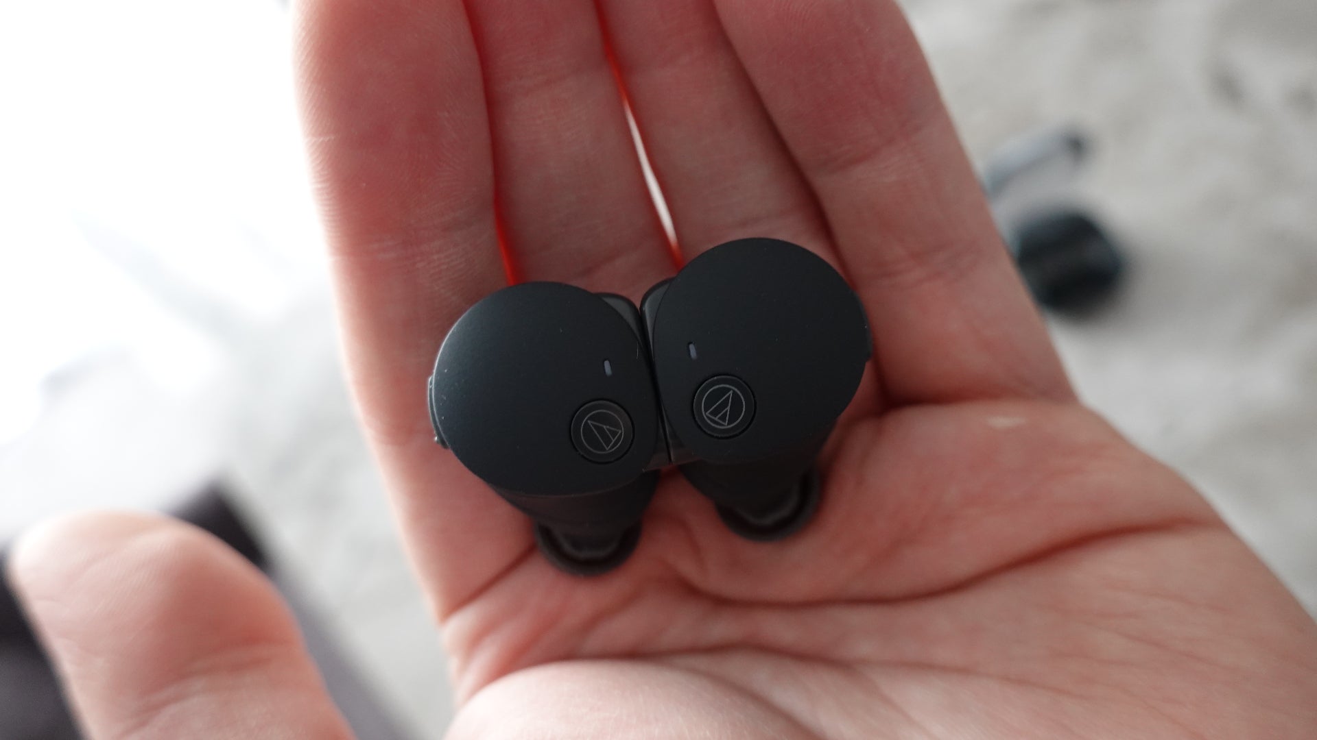 Audio-Technica ATH-CKS50TW2 earbuds in hand