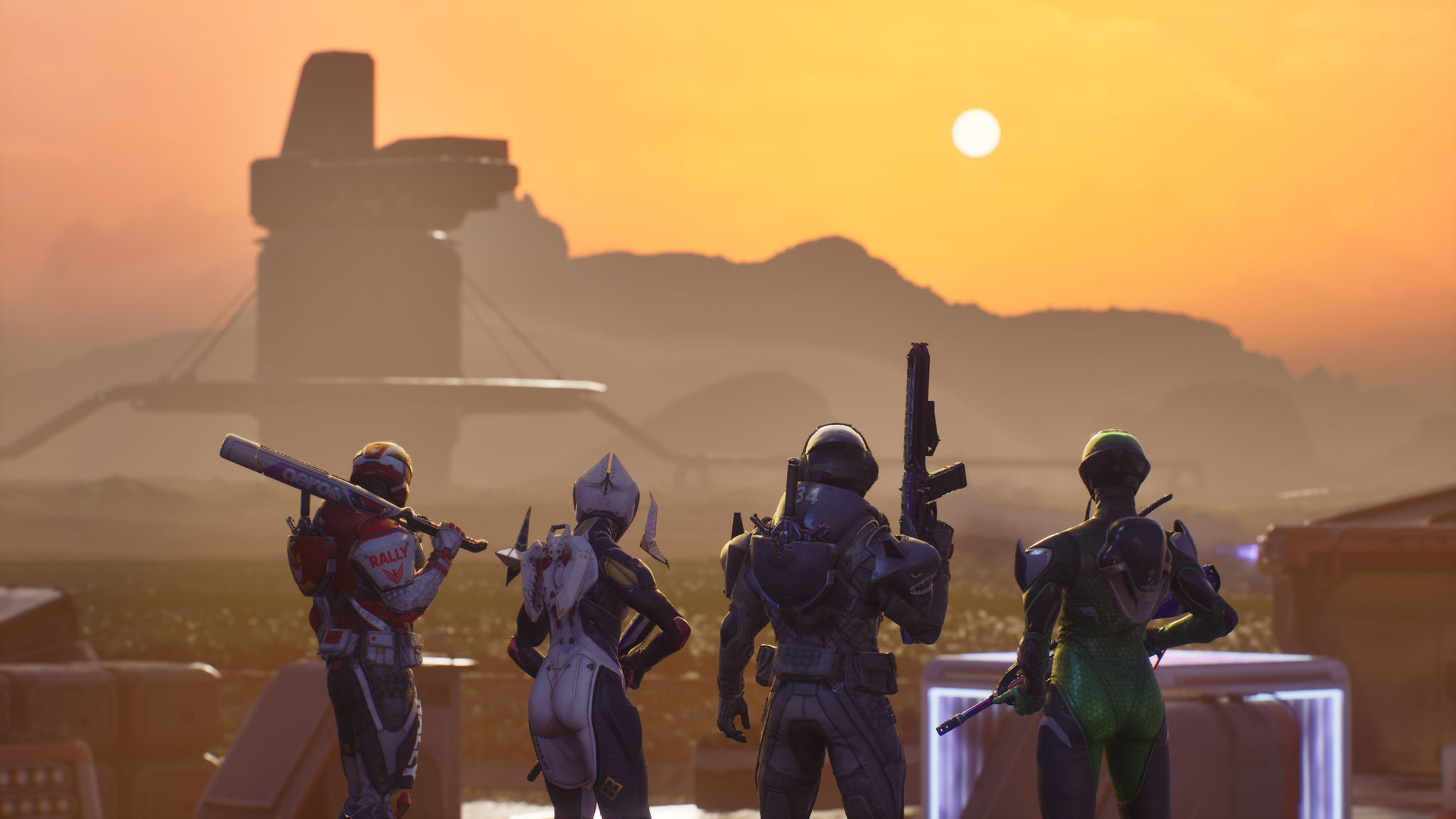 Splitgate: Arena Reloaded screenshot showing four armed characters look out towards the setting sun