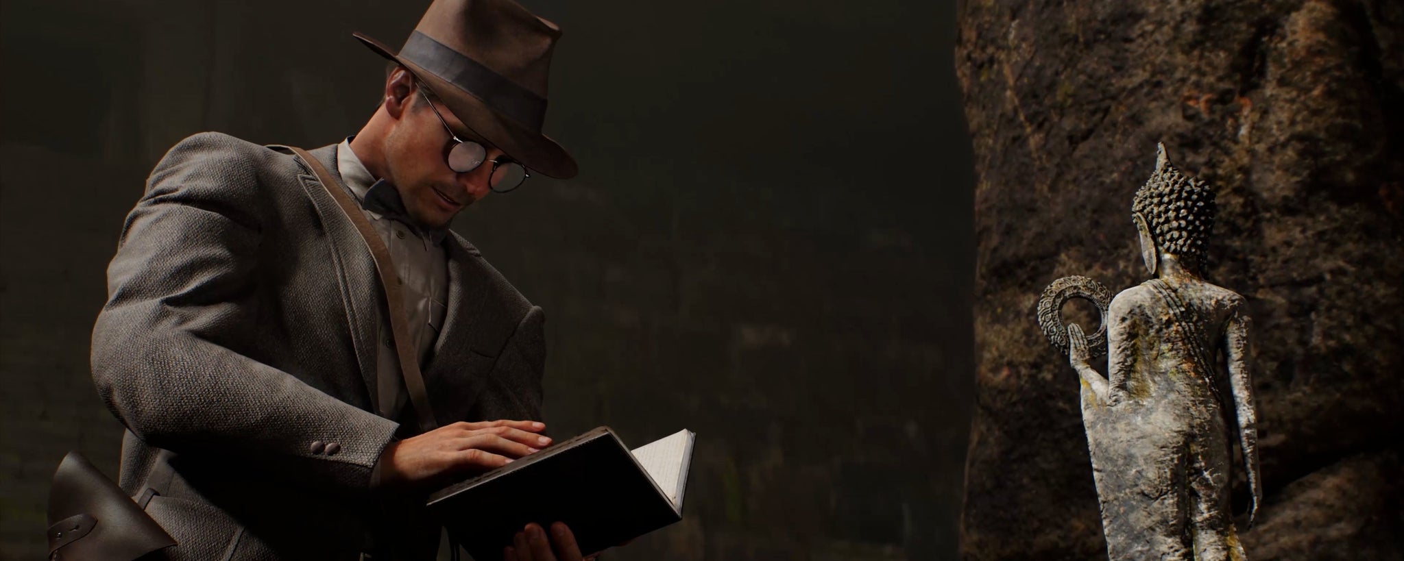 Indy in the Great Circle wearing a jacket and his fedora with round glasses and a bowtie