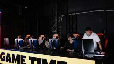 Professional esports tournament stage with large screens and competitive gaming setup