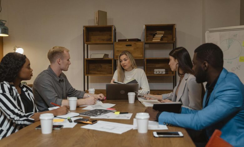 Business professionals discussing strategy in modern conference room