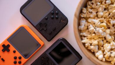 Modern gaming console with controller on entertainment center