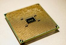 Close-up view of a modern CPU processor showing intricate circuit patterns and heat spreader design