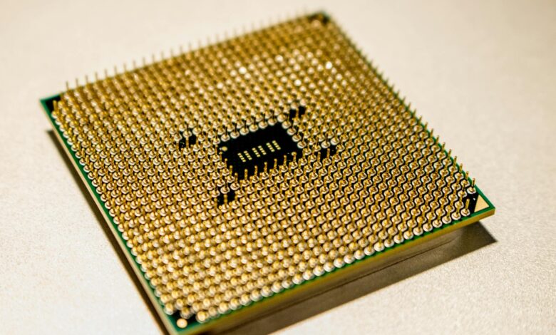 Close-up view of a modern CPU processor showing intricate circuit patterns and heat spreader design