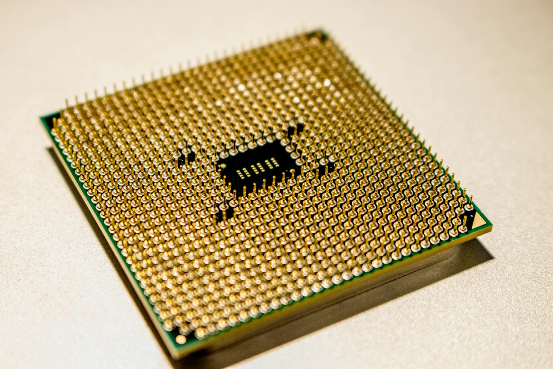 Close-up view of a modern CPU processor showing intricate circuit patterns and heat spreader design