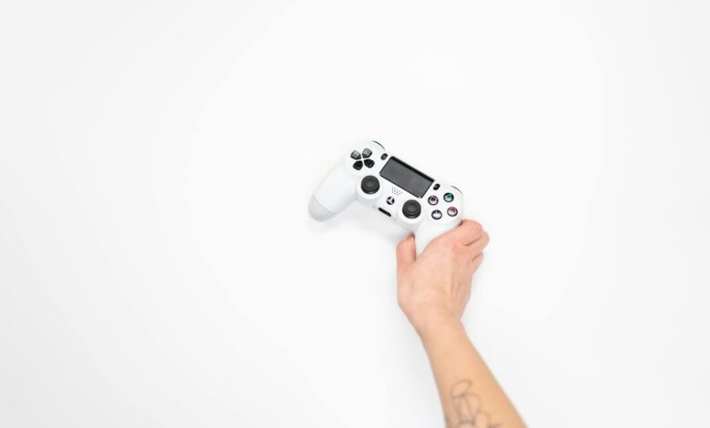 Modern gaming controller next to console showing indie game interface