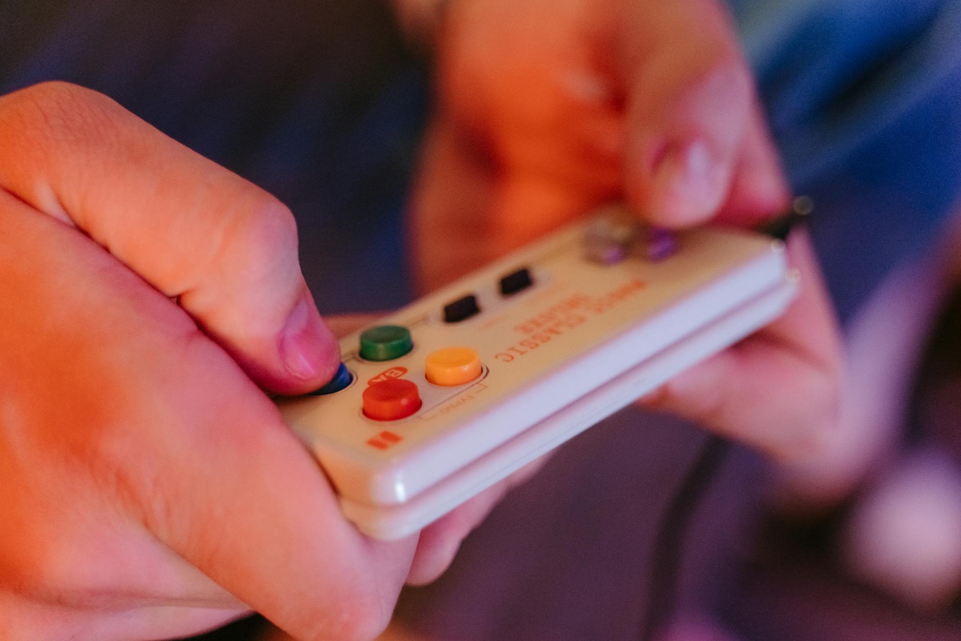 Close-up of retro gaming controller on dark surface, representing classic Nintendo gaming experience