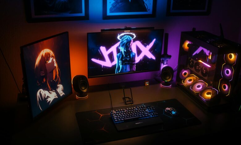 Gaming streaming setup with monitors, keyboard, and professional lighting equipment