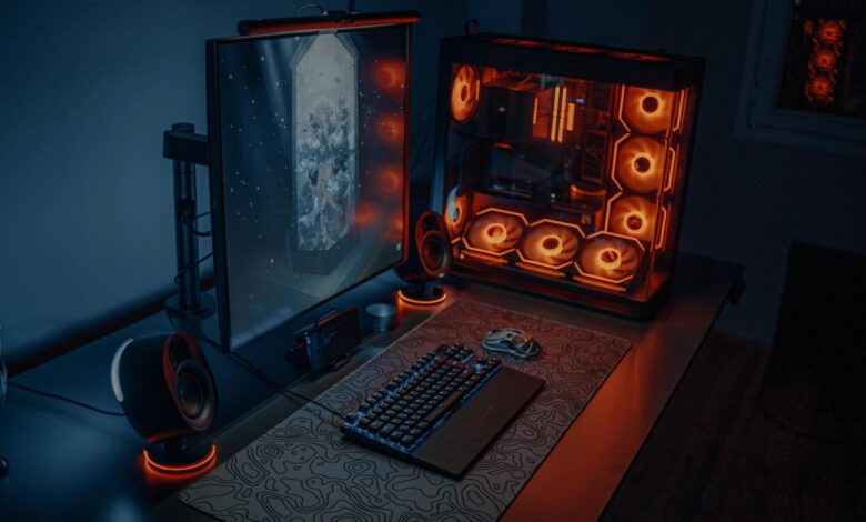 Gaming computer setup with multiple monitors displaying video game interface