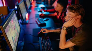 Large esports arena with screens and stage setup for competitive gaming tournament