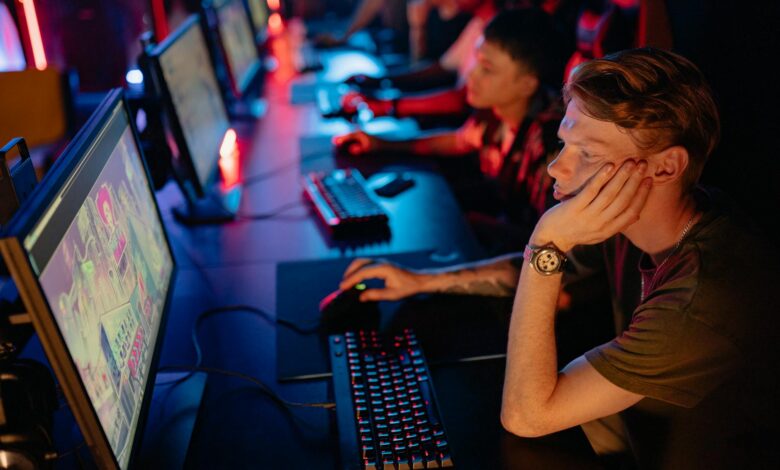 Large esports arena with screens and stage setup for competitive gaming tournament