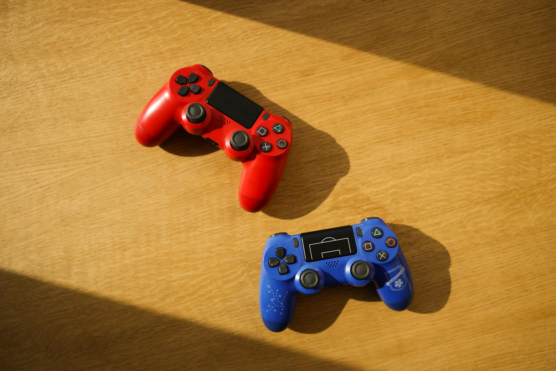 Multiple gaming controllers from different console brands arranged together