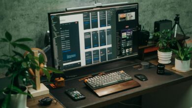 Gaming computer setup with monitor displaying system settings optimization interface