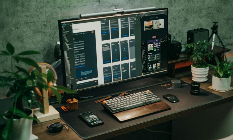 Gaming computer setup with monitor displaying system settings optimization interface