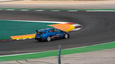 Professional racing car on circuit track showcasing high-speed motorsport action