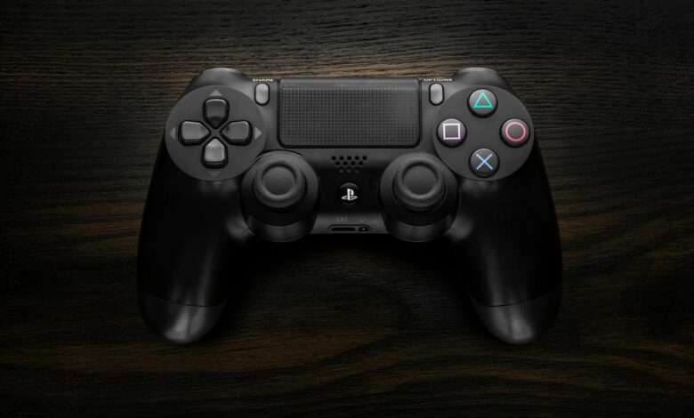 Gaming controller in atmospheric lighting representing survival horror gaming experience