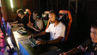 Professional gaming tournament setup with multiple screens and competitive gaming equipment