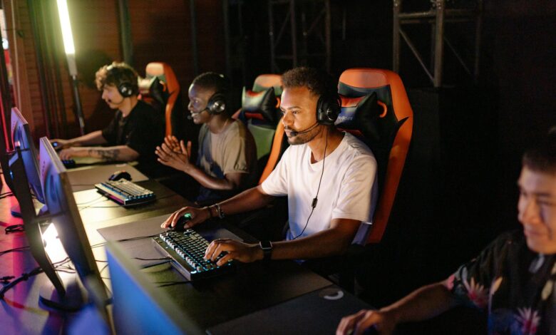 Professional gaming tournament setup with multiple screens and competitive gaming equipment