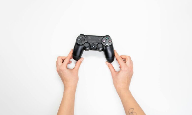 Hands holding a gaming controller during Street Fighter gameplay session