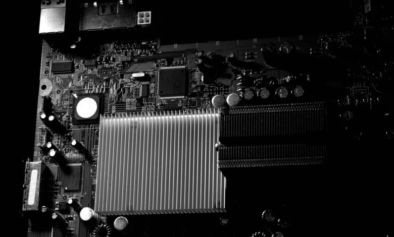Close-up view of computer graphics card installed on motherboard showing GPU cooling system