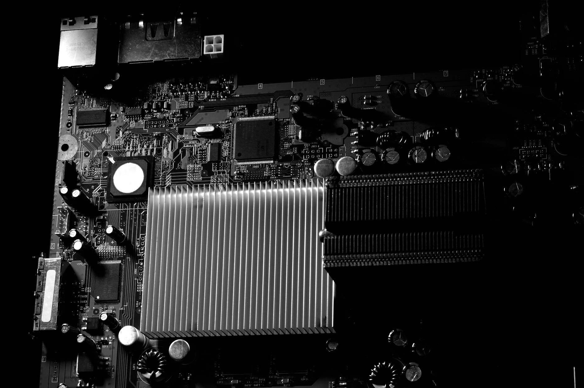Close-up view of computer graphics card installed on motherboard showing GPU cooling system