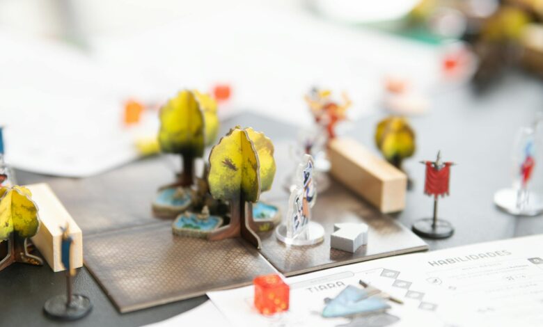 Gaming setup with fantasy RPG elements and dice on wooden table