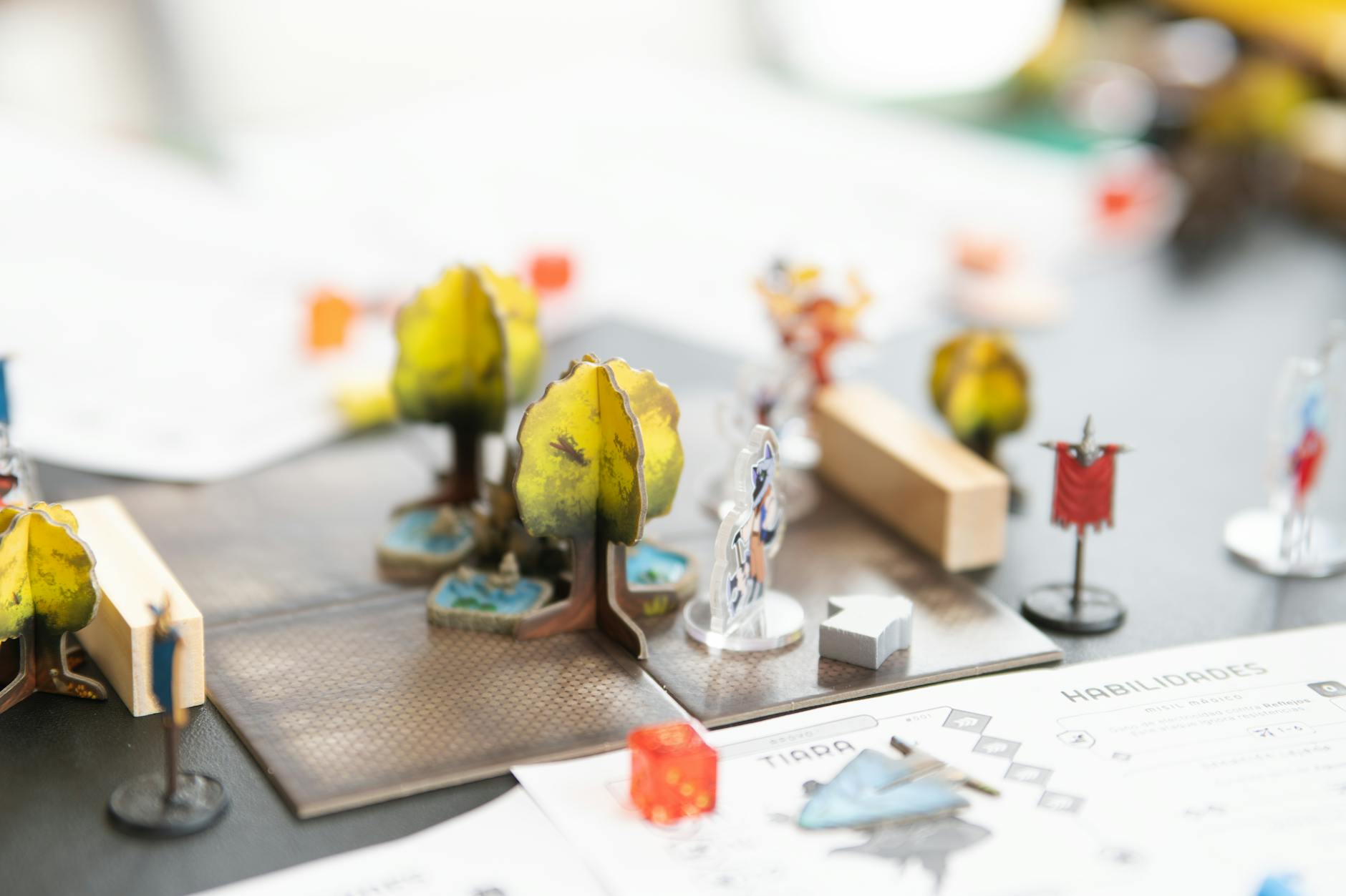 Gaming setup with fantasy RPG elements and dice on wooden table