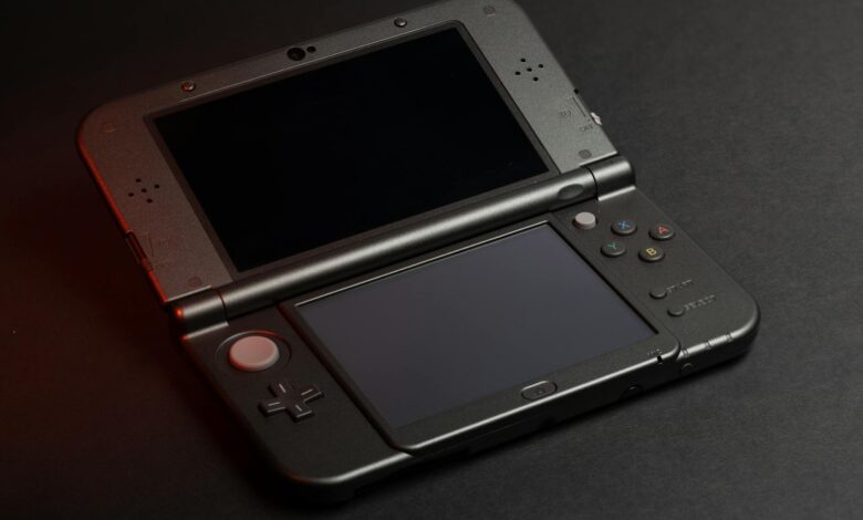 Close-up view of handheld gaming device screen showing vibrant game graphics