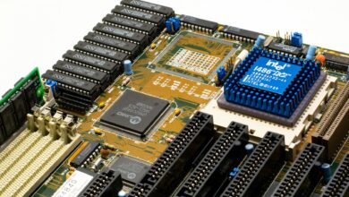 Close-up view of a gaming PC motherboard showing M.2 SSD slots and cooling components