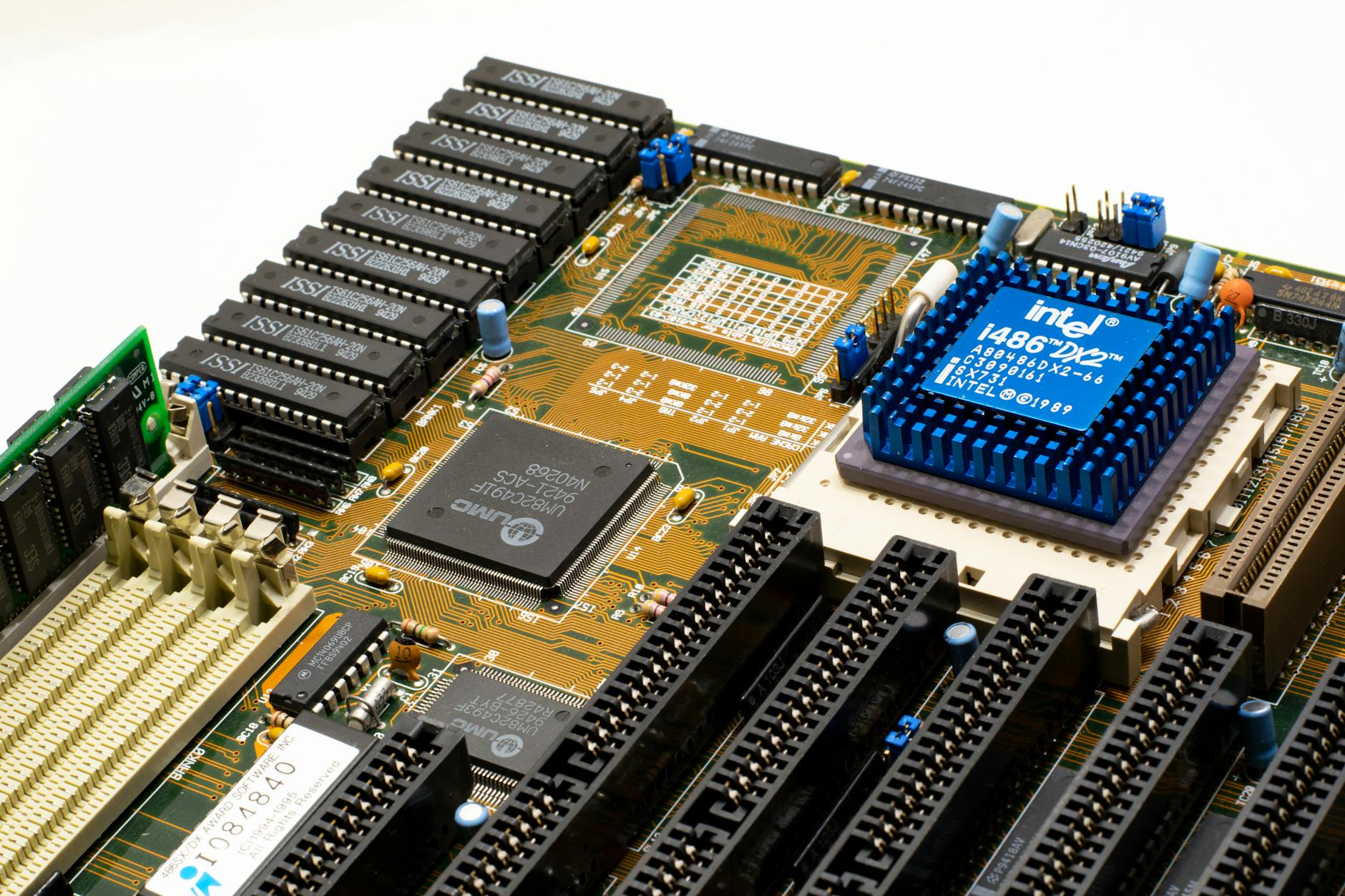 Close-up view of a gaming PC motherboard showing M.2 SSD slots and cooling components