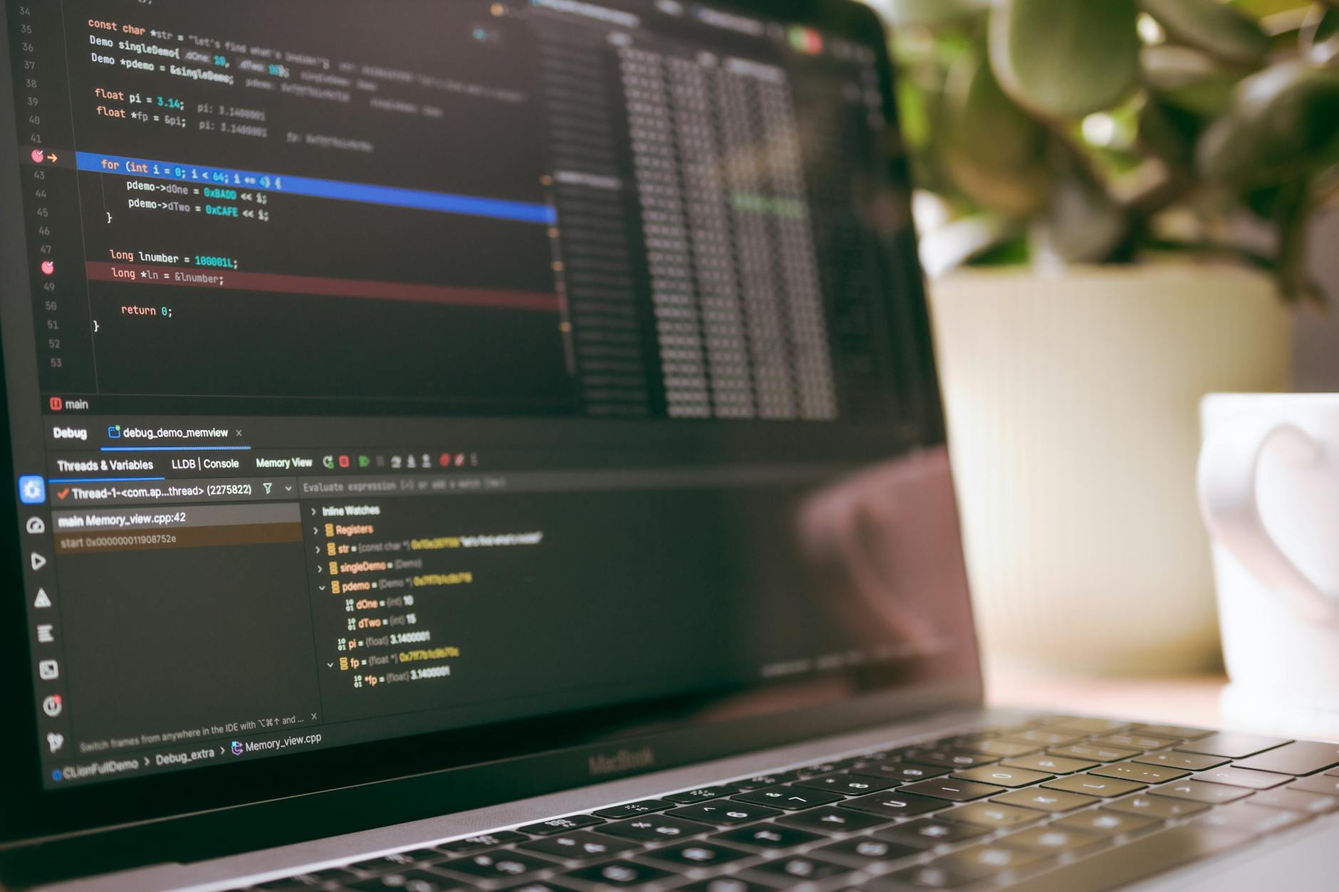 Game developers working on computers in a modern development studio environment