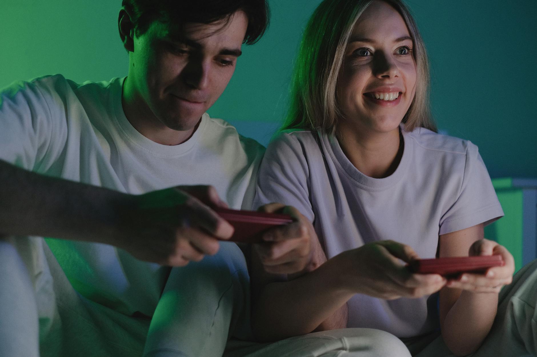 Two people playing video games together showing relationship dynamics in gaming