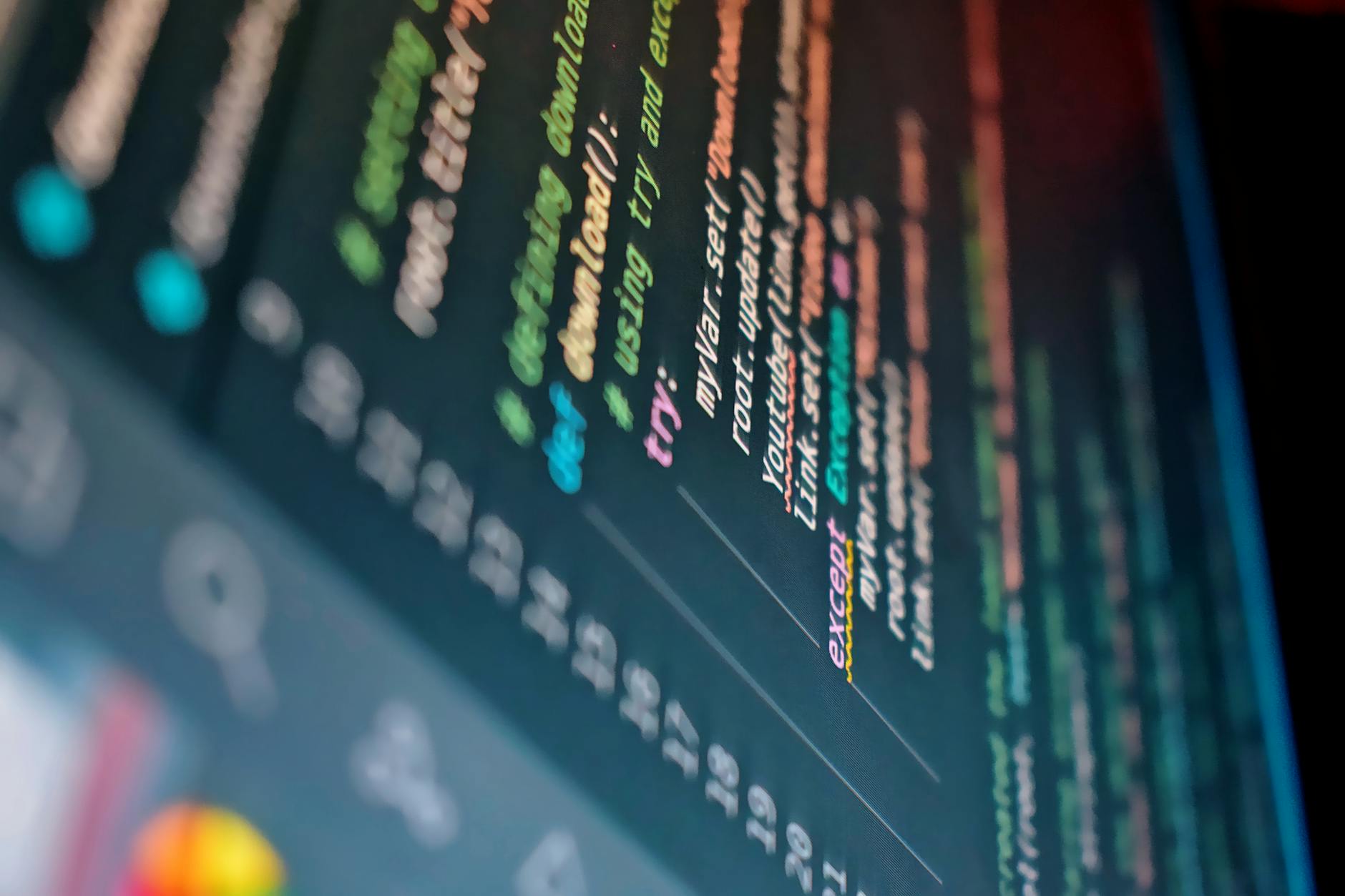 Developer working on computer with game development code on screen