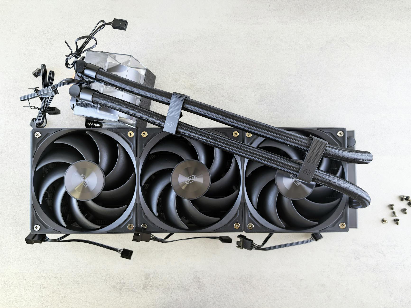 Person assembling a gaming PC with motherboard and components visible inside case