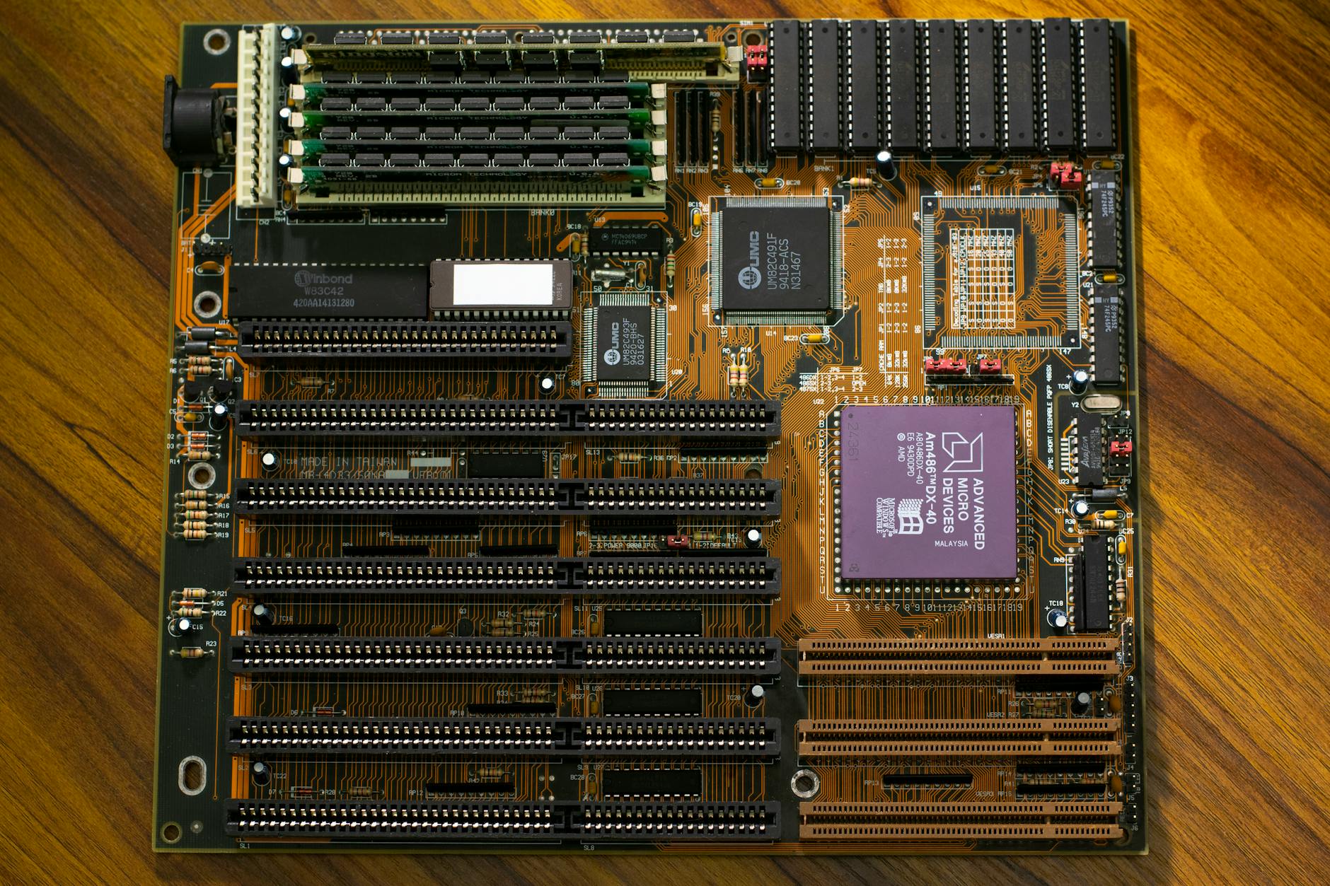 Close-up view of NVMe solid state drive being installed in computer motherboard