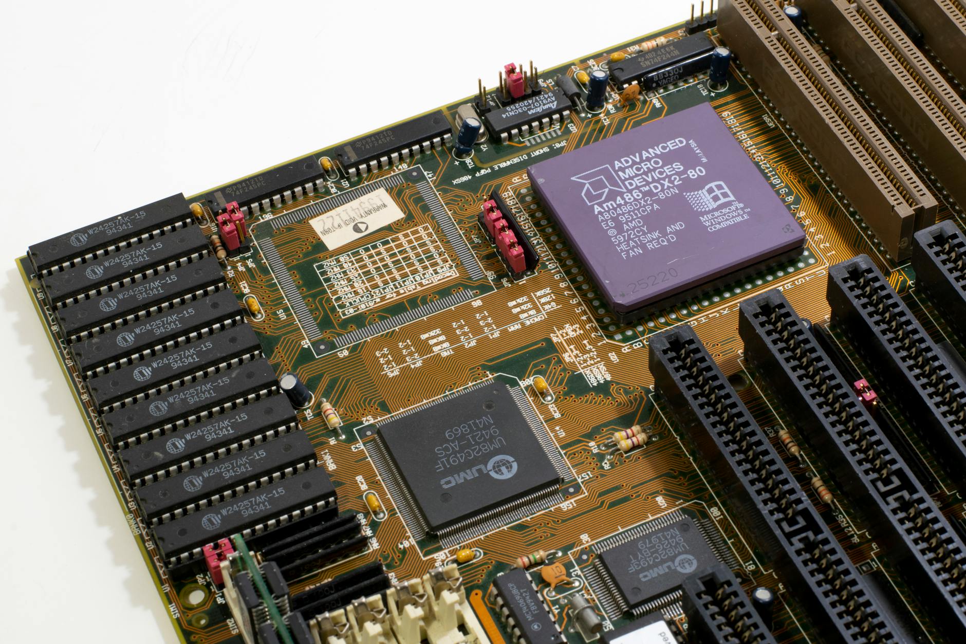 Close-up view of PC hardware components including graphics card and motherboard with detailed circuitry