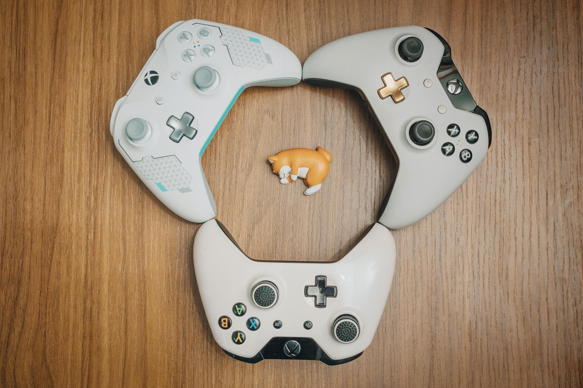 Modern gaming controller with classic game elements on screen