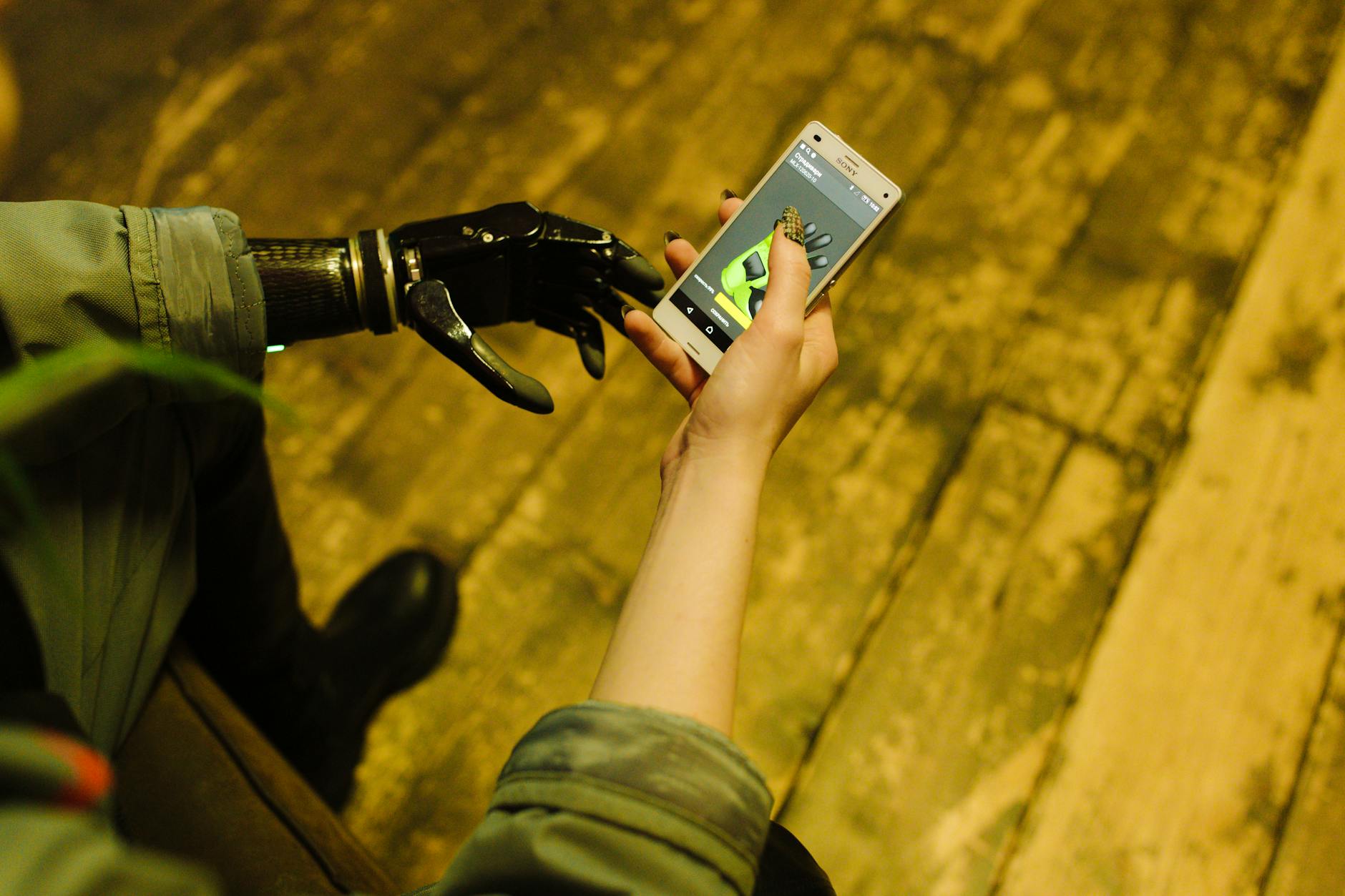 Person holding portable gaming device with focused expression