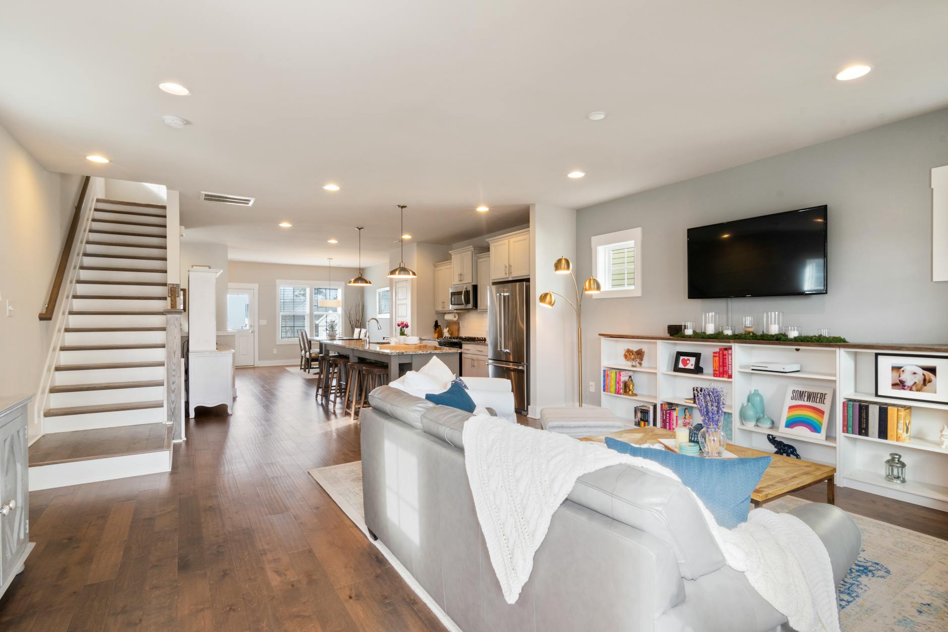 Comfortable living room setup with large TV screen and gaming console entertainment center