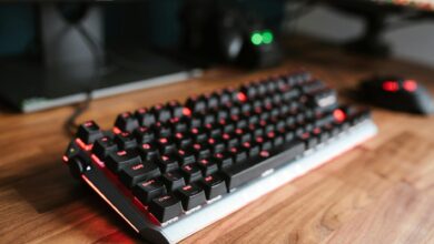 Mechanical gaming keyboard on a clean desk setup with ambient lighting