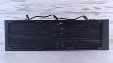 Close-up view of computer liquid cooling radiator with fans and tubing