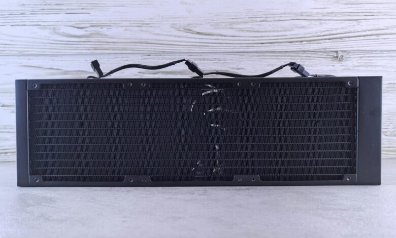 Close-up view of computer liquid cooling radiator with fans and tubing