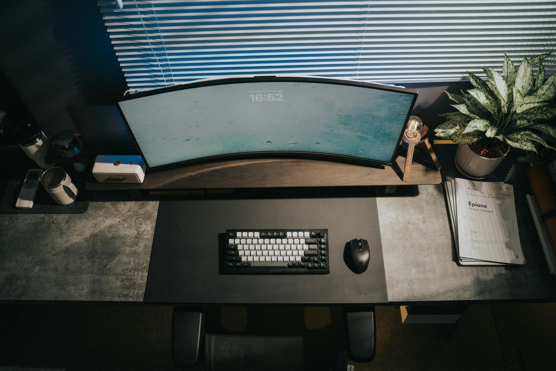 Curved ultrawide gaming monitor on desk with RGB lighting