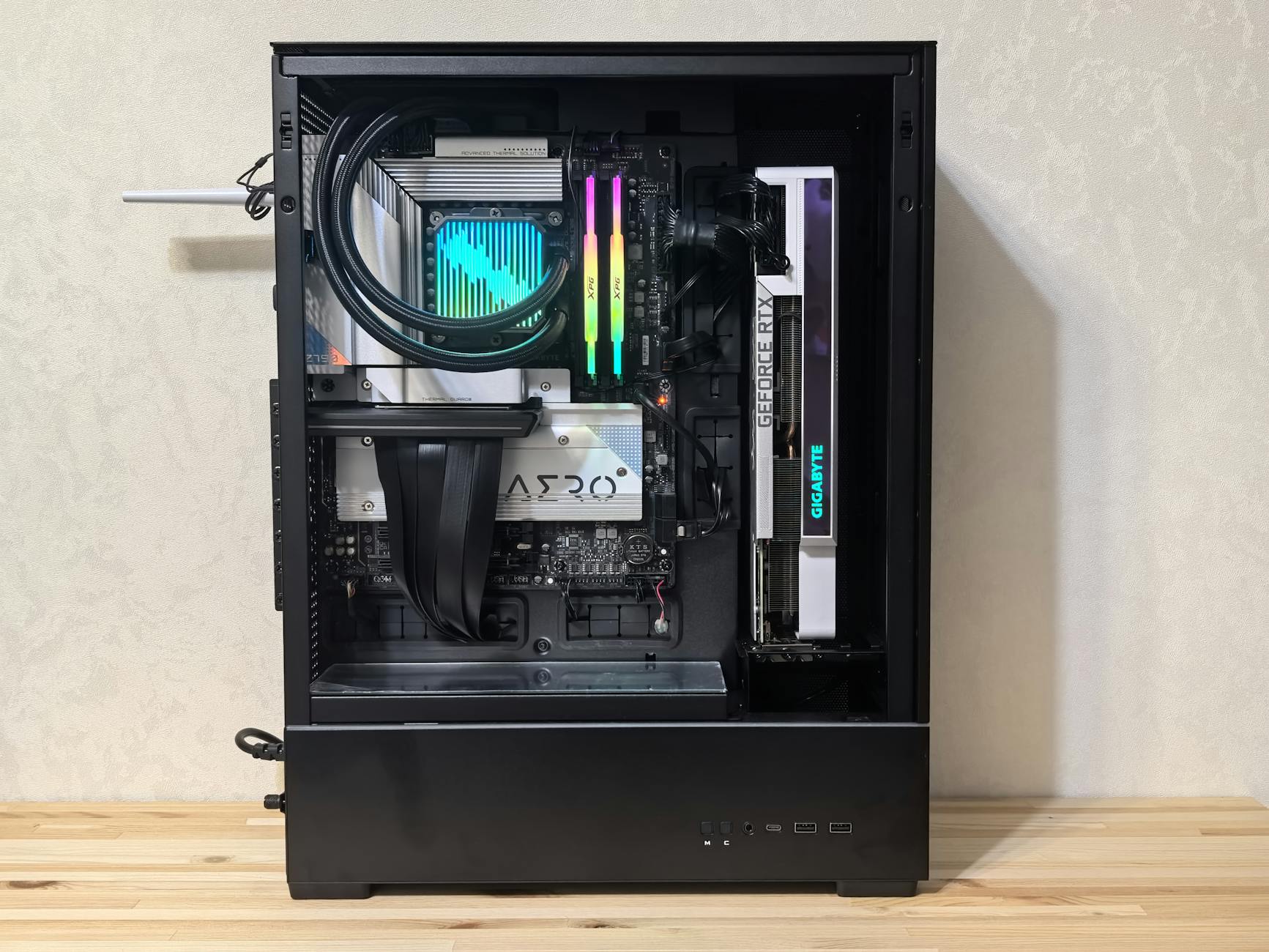 Interior of a gaming desktop PC showing cooling and GPU installation relevant to thermal performance testing