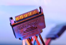 Close-up of a modular PC power supply unit with cables attached