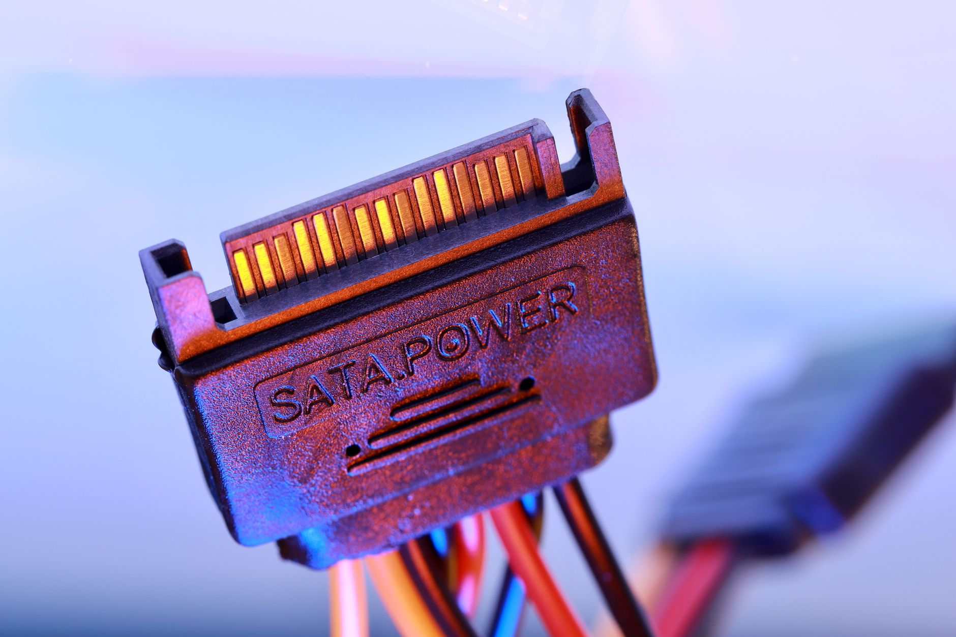 Close-up of a modular PC power supply unit with cables attached