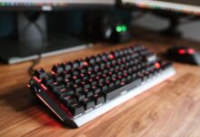 Premium mechanical keyboard on a gaming desk setup with RGB lighting